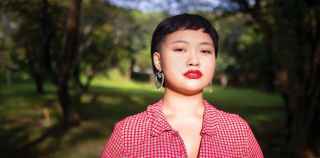 Image of young asian woman in a red shirt